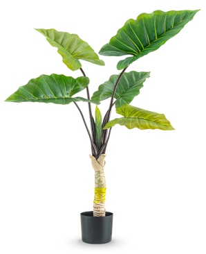 Den kunstige plante Calocasia 120 cm har store, brede grønne blade og en tyk central stilk i en høj potte, mod en almindelig hvid baggrund.