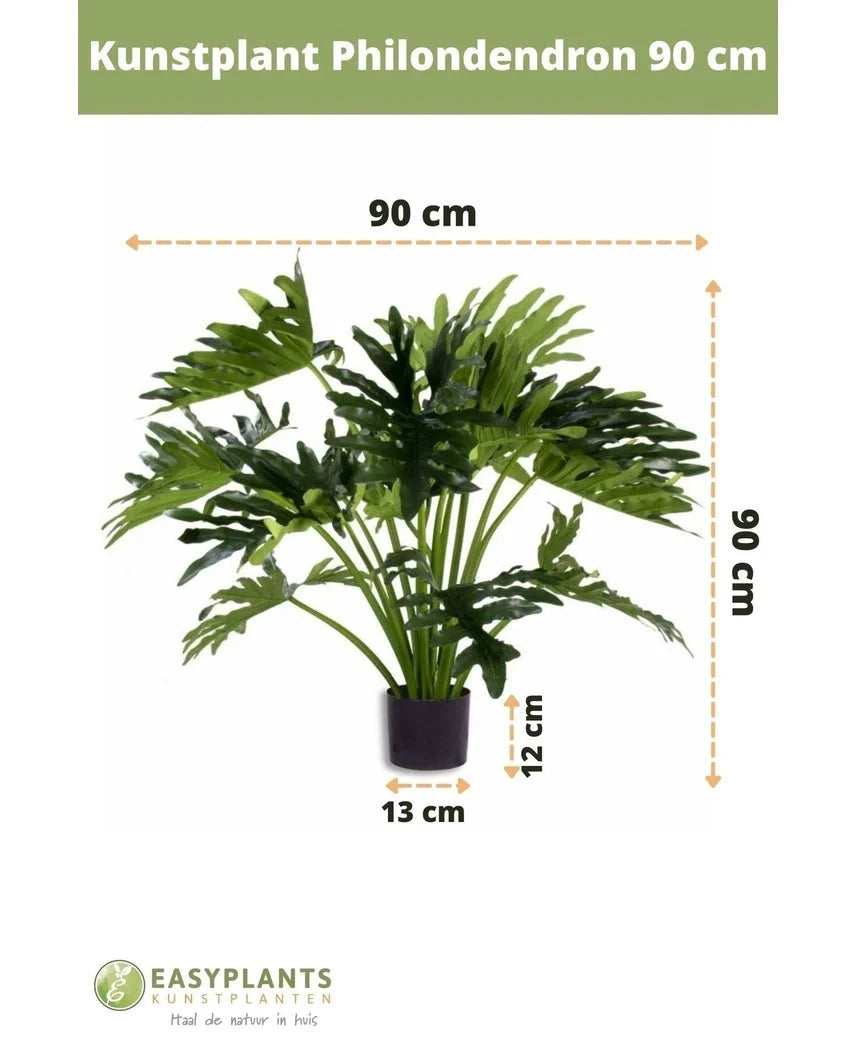 Kunstig plante Philodendron UV 90 cm i sort potte, med 90 cm brede blade. Perfekt til ethvert rum. Pottestørrelse: 12 cm høj, 13 cm bred. Easyplants logo i bunden.