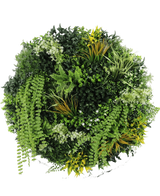 Den kunstige hæk på sort ramme Ø100 cm har et cirkulært arrangement af forskellige grønne planter og løv, herunder bregner, snoede vinstokke og blade med gul spids, med forskellige bladformer og teksturer mod en hvid baggrund.