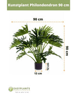 Kunstplant Philodendron UV 90 cm in een zwarte pot, met 90 cm brede bladeren. Perfect voor elke ruimte. Potmaat: 12 cm hoog, 13 cm breed. Easyplants logo onderaan.
