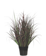 Kunstgræsplanten Vildplæne 70 cm, brandhæmmende, har mørkegrønne og rødlilla smalle blade i en sort potte - perfekt som vedligeholdelsesfri plante til ethvert interiør.